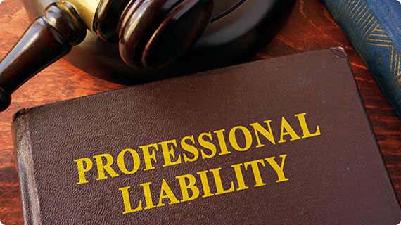 Legal book on professional liability, highlighting out-of-court claim resolution services.