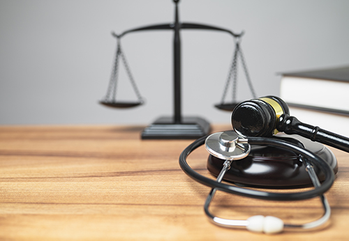 Mediation for personal injury cases with gavel, scales of justice and stethoscope in Placer County